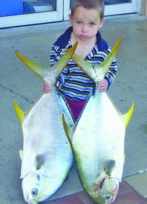 Young Brody with two snub nosed dart (permit) caught on the Urangan pier.